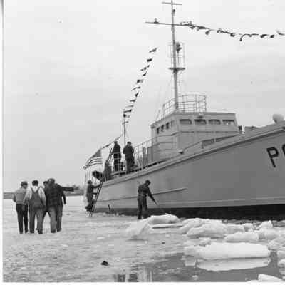 Men clearing ice around PC-536