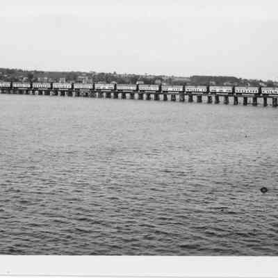Railroad cars on trestle of Leathem and Smith bridge