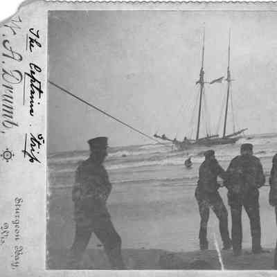 Breeches buoy being used to save captain Kaufman of the Otter, October 10, 1895