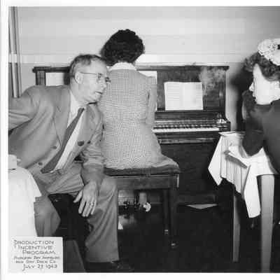 Woman playing piano at SBSB&DD Co. production incentive program July 27, 1943