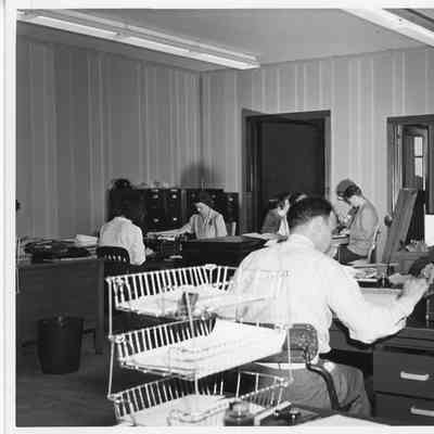 Men and women employees in L.D. Smith Shipbuilding Co. office