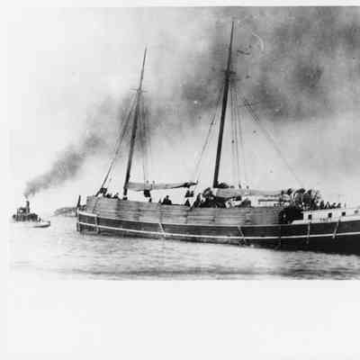 Schooner Troy loaded with lumber being towed