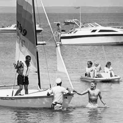 Hobie One sailboat with man standing on board