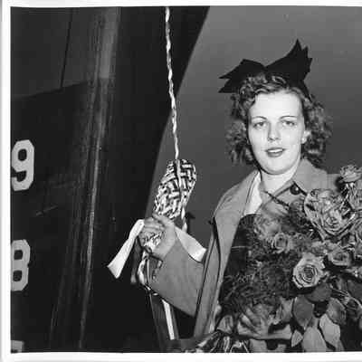 Helen Larson holding christening bottle at christening of PC-1226