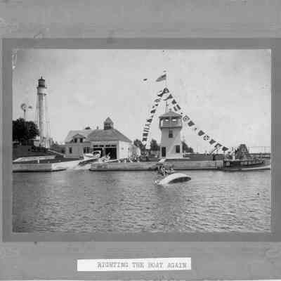Coast Guard in boat before roll over test at Sturgeon Bay Canal Station 1919