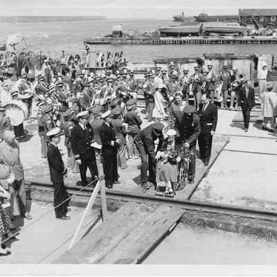 Senator Joseph McCarthy with wife at christening of LST-1170 May 22, 1954