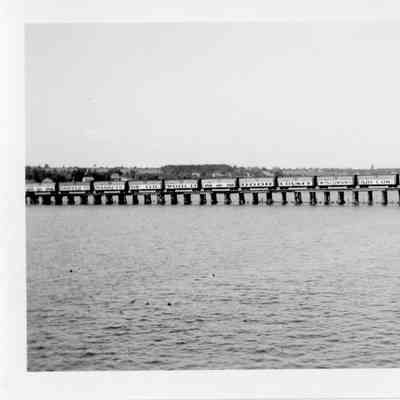 Railroad cars on trestle of Leathem and Smith bridge