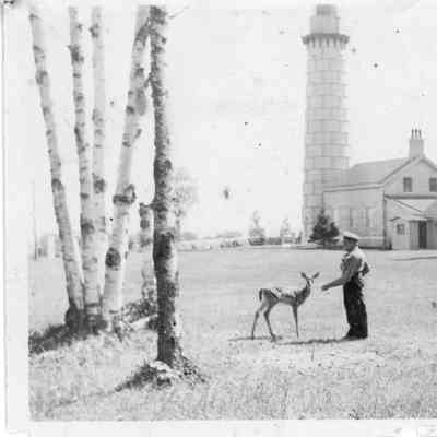 Keeper Ross Wright and deer at Cana Island Lighthouse