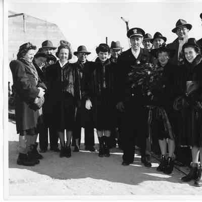 Alva Smith, L.D. Smith, and C. Ray Christianson with group outside
