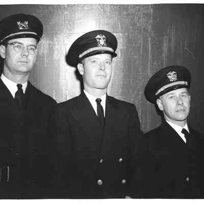 Three men at launching of PC-1179
