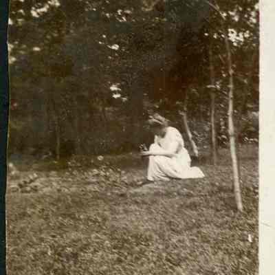 Woman kneeling in garden