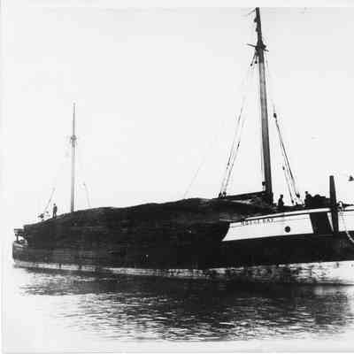 Noque Bay loaded with lumber being towed