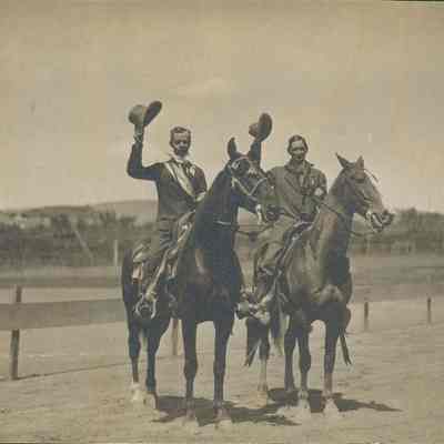 Two men on horseback at track