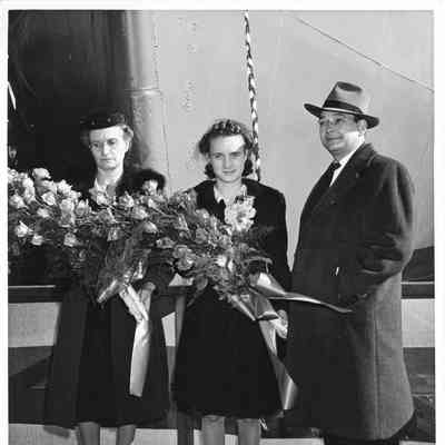 Mrs. H.G. Hughes, Marilen Hughes and Adam Baryezka at christening AK-209 Schuyler