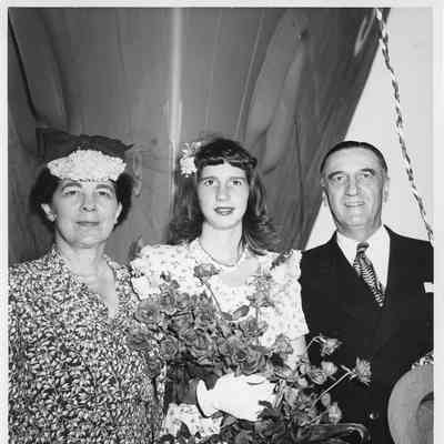Miss Joan Brugess in center holding roses at PC-1175 christening
