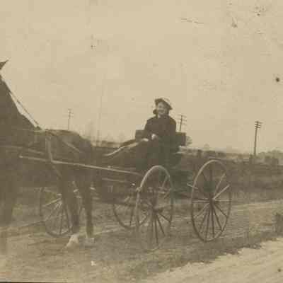Woman sitting on a buggy