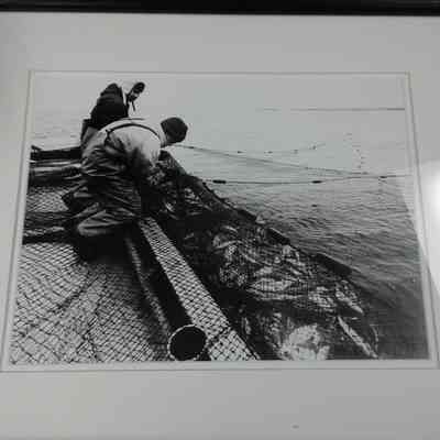 Framed photograph of Mark Weborg and James Rice bagging whitefish