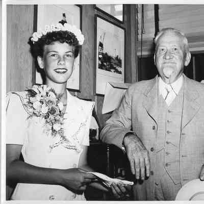 man and woman in office during M award