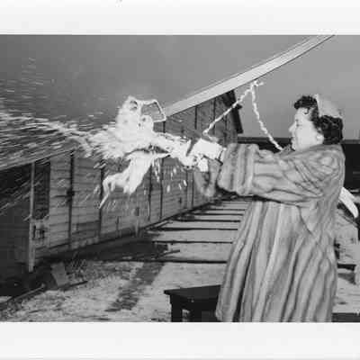 Woman christening boat