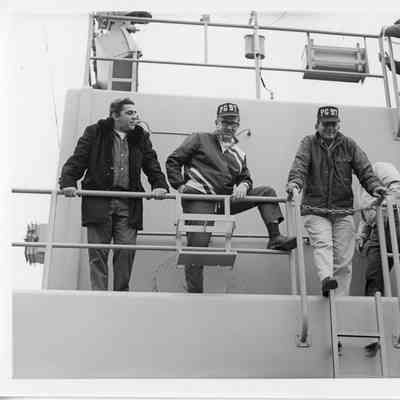 Men posing on deck of PG-97 USS Surprise