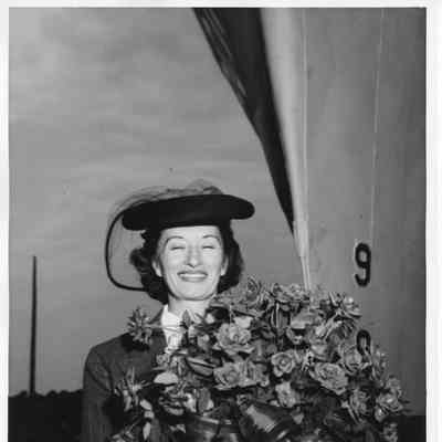 Mrs. Sydney T. Smith holding roses