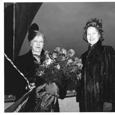 Mrs. Edward Frick holding roses with alva Smith