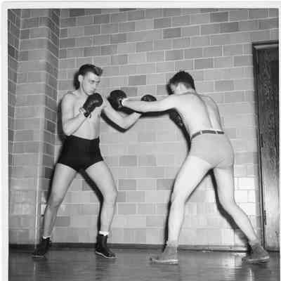 Two men boxing with shirts off