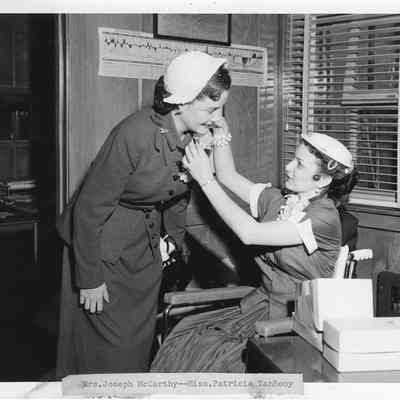 Mrs. Joseph McCarty with Miss Patricia Van Rooy at Christening of LST-1170 May 22, 1954