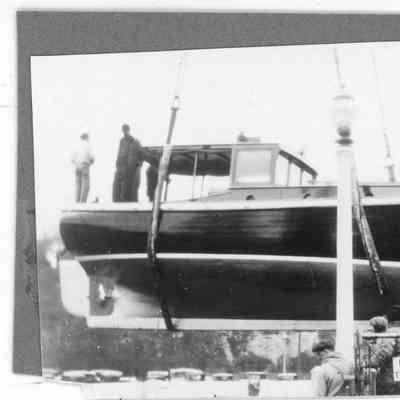 vessel suspended with men on board