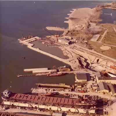 Aerial view of shipyard with several vessels including Cleveland Cliffs