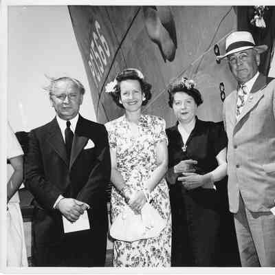 L.D. Smith and Alva Smith standing in front of bow of PC-1566