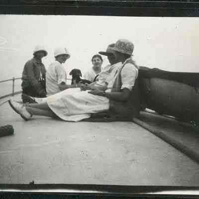 Women seated on deck of Oweenee