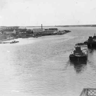 Two vessel on the water with tug in front