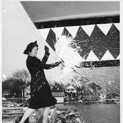 Mrs. Nick Propesur christening P-569 at Peterson Boat Works May 20, 1944