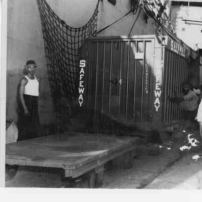 Safeway Shipping container on platform next to ship