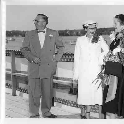 Mr. and Mrs. C. Ray Christianson and woman with roses during christening of LST-1169 August 22, 1953