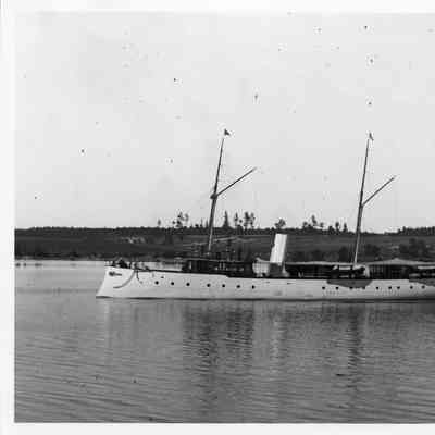 Yacht with two masts flying pennants