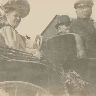 five people riding in carriage