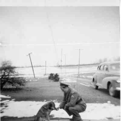 Father shaking dog's paw