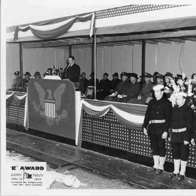 man giving speech during Army/Navy E award April 20, 1944