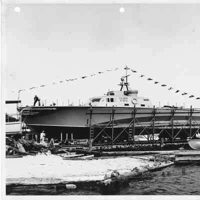 Man standing on deck of P-572 in cradle at Peterson Boat Works August 8, 1944