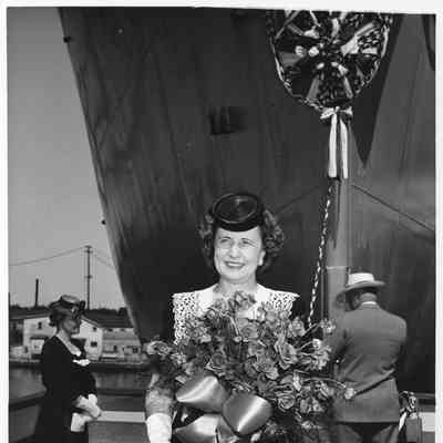 Mrs. Lawrence H. Smith holding roses
