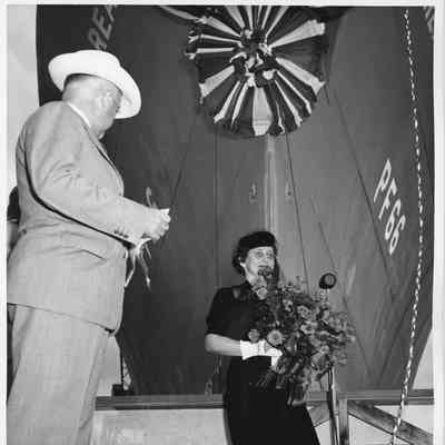 L.D. Smith and Mrs. John Butterweck standing near the Reading