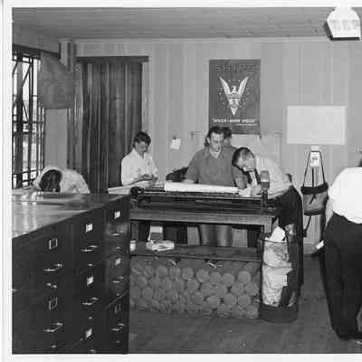 Unidentified men in work room