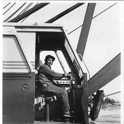Sturgeon Bay Ship Canal man in cab of dredging equipment 1964