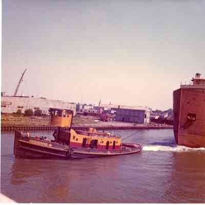 Tug Adrienne B towing freighter view from bow of tug
