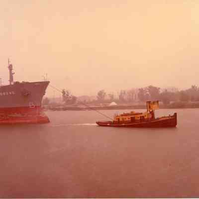 Tug Adrienne B towing 730' freighter in Calumet Harbor