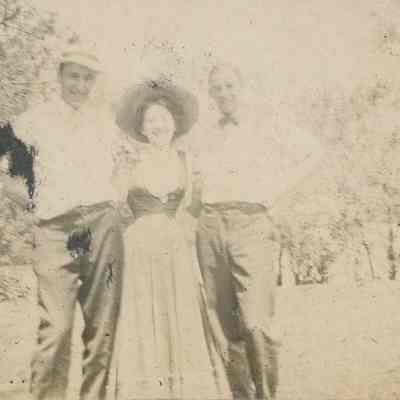 Three people posing for photo