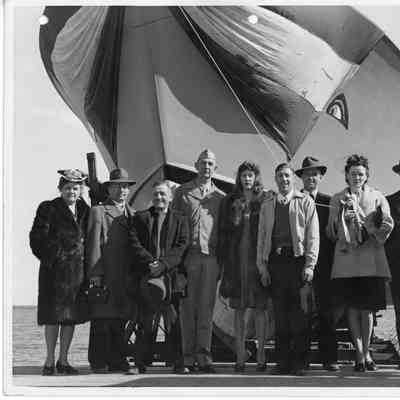 P-568 sponsor party posing in front of Pf-568 at Peterson Boat Works April 12, 1944