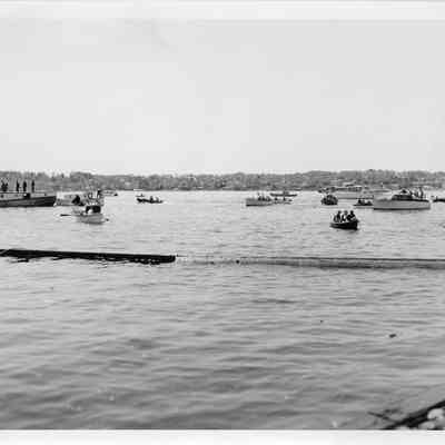 Group of boat in water during launching of LST-1170, May 22, 1954